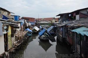 Fishing boats and slums at the harbour